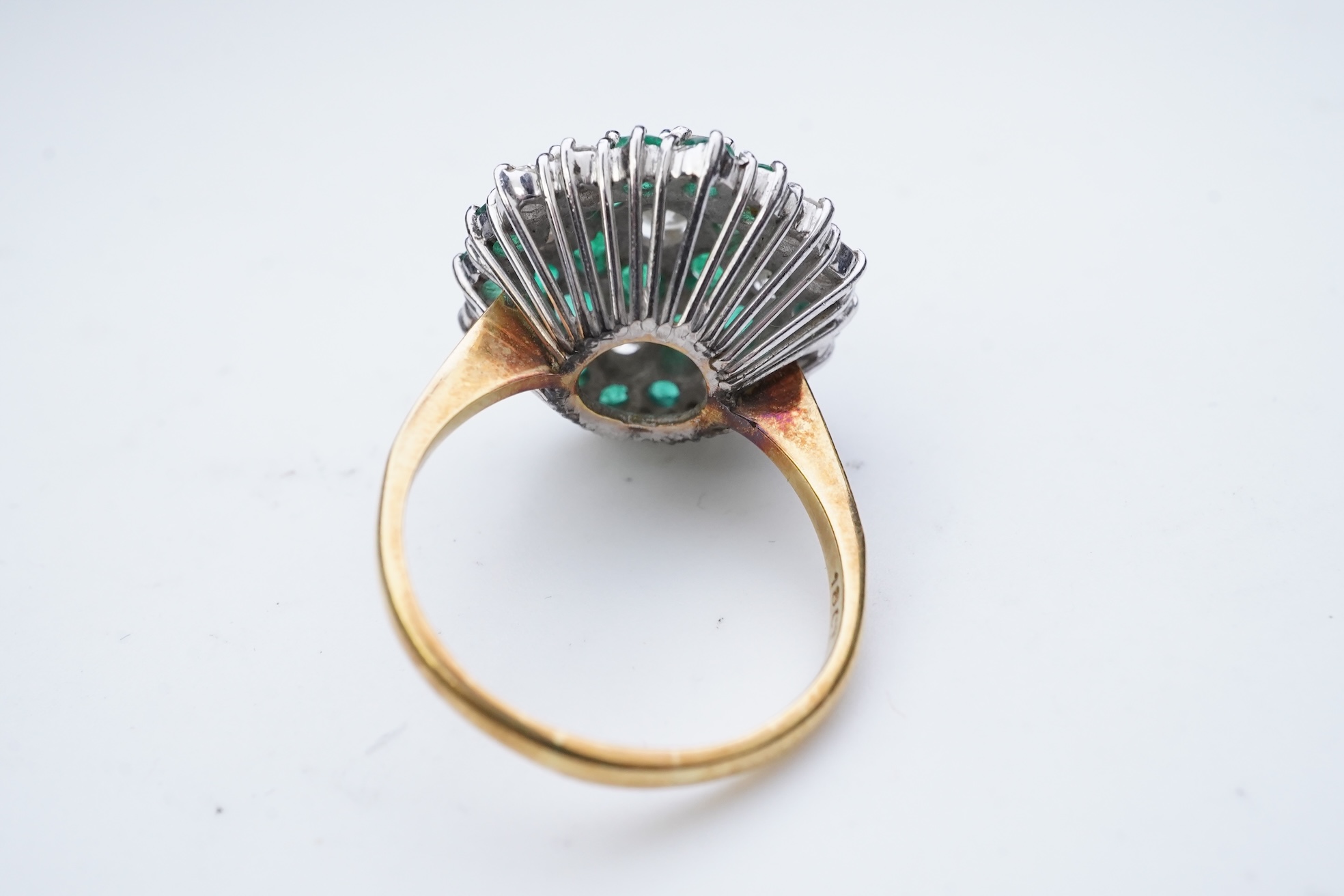 An emerald and diamond cocktail ring